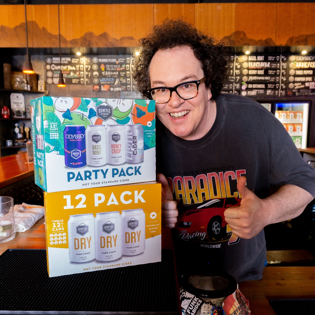 Gus showing of our new Dry cider 12pk AND our new Party Pack (12pk) of Odyssey, Basil Mint, Honeycrisp, and Light Cider! Available now at The Woods Tasting Room and on Vino Shipper. 

seattlecidercompany.com/home/cider-fin…

#New #12pk #PartyPack #SeattleCiderCo