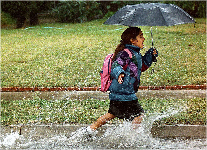stanlimphoto's tweet photo. The fun shot from @watcharaphotog on the cover of the @sbsun reminds me of the time I photographed this girl running through a gutter during a storm. When I stopped to get her name she started crying because she thought she was in trouble. Ha!!! https://t.co/oibuI2NPKo