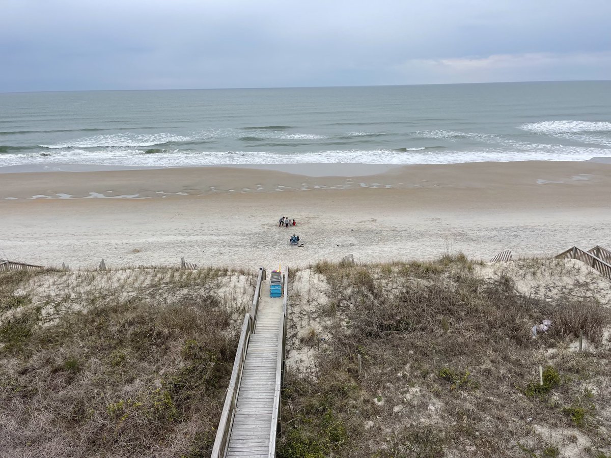 You have to expand the pic to catch the action. But here w the expanse of the Atlantic &amp; endless miles of uncluttered beaches, 4 little g-sons content themselves w shovels &amp; a few sq ft of sand. What if we all enjoyed life’s simplicity apart from the clutching pursuit of it all?