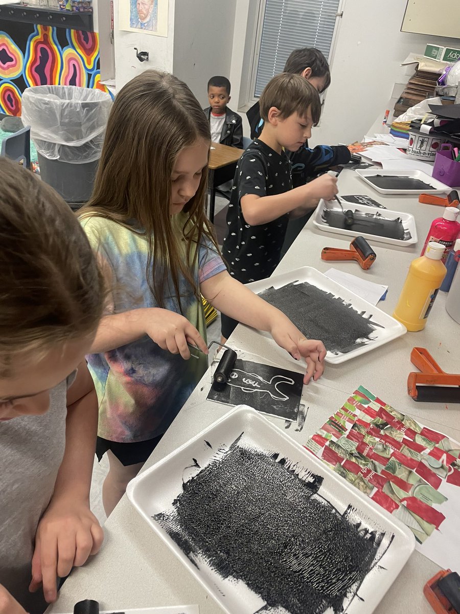 Students in third grade began printing during a printmaking lesson today! Students are inking their printing blocks which they drew and carved.