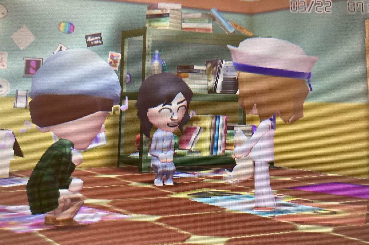 Robin, Mike, and Will are playing with a cat!