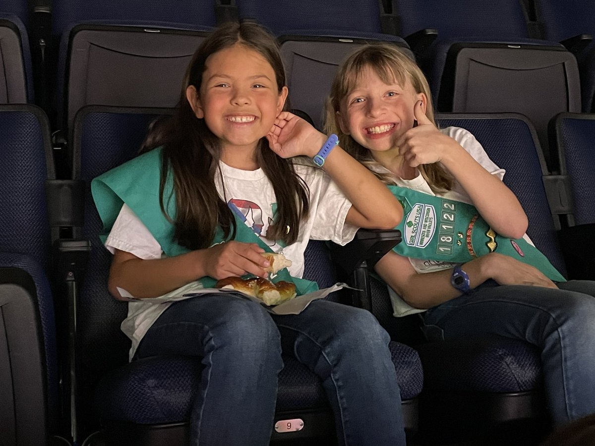 Two of the color guard Girl Scouts enjoying the game. Go wolves!  #packpix