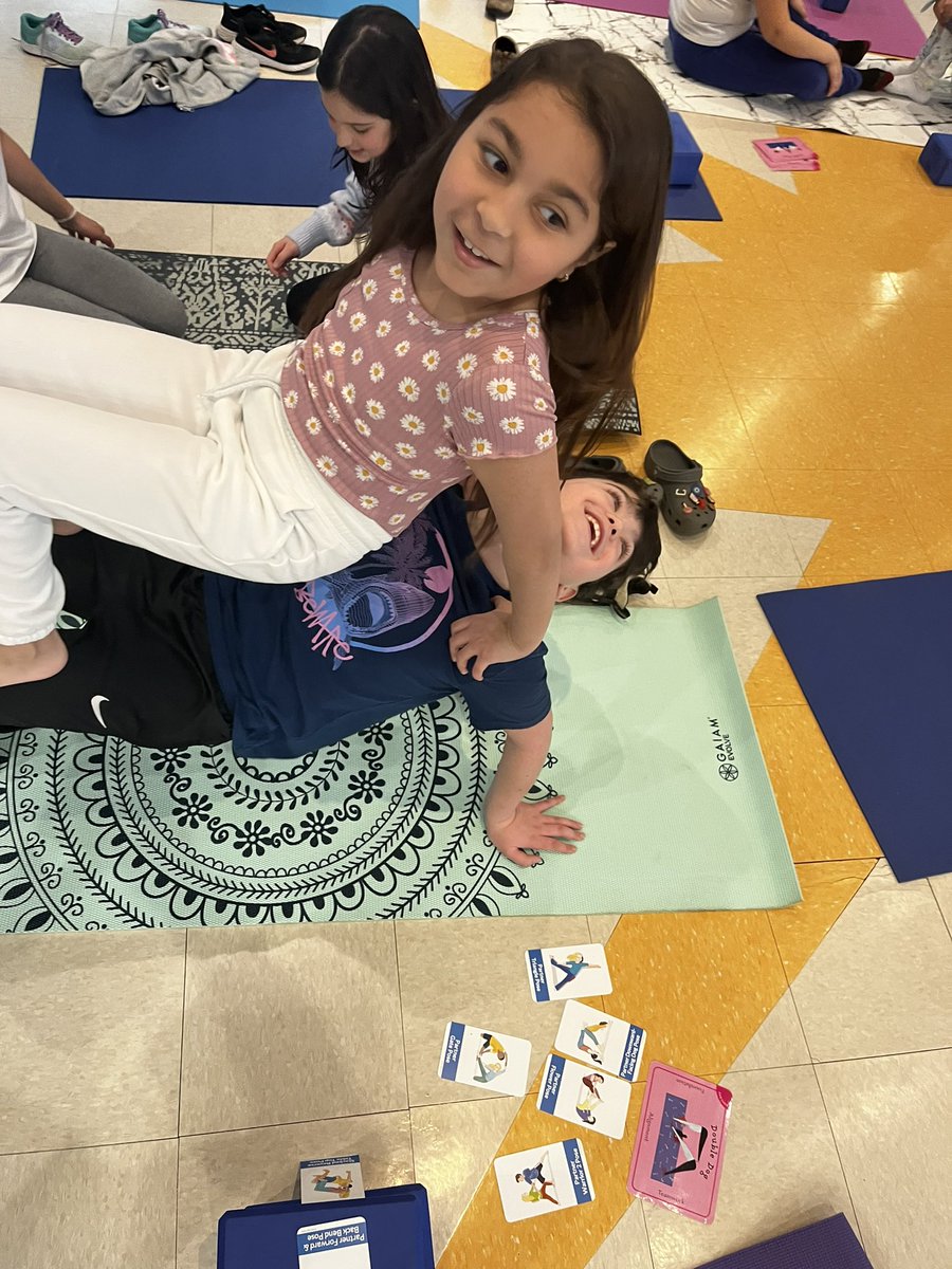 Yogi says and partner poses.  Empowering kids. 

“I feel so energetic” “me too” “why can't we do yoga every day?” -kids