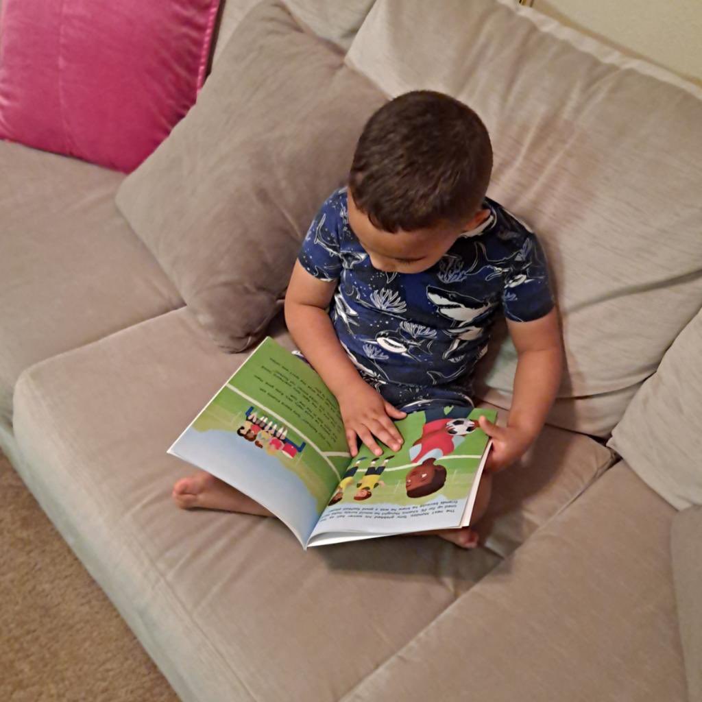 Kaje grabbed his new favorite picture book and a nice spot on the comfy couch 📚 and took a picture walk through #FriendshipinAnyLanguage. 
#DiverseChildrensBooks #jgauseglobal #childrensbooks #jgausewrites #kidsbookstagram #picturebooks #kidsbookstagram #childrensliterature