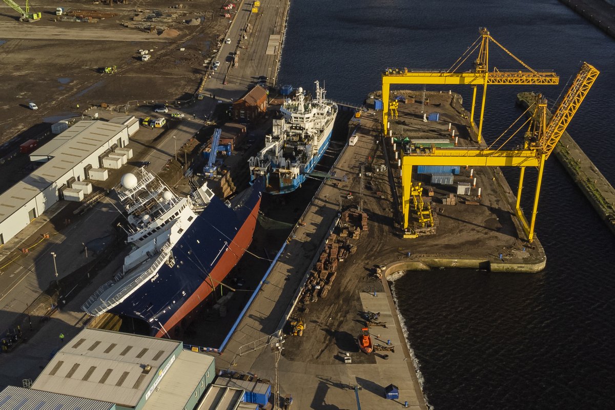 View of Ship 'Petrel' tipped over at a 45-degree angle due to high winds in the Imperial Dock area in Leith, Edinburgh.