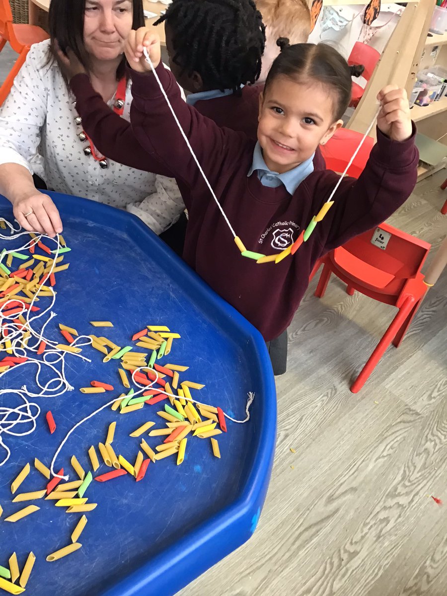 CharlesPrimN's tweet photo. Using our fine motor skills this morning, to make tribal African necklaces inspired by our story Handas Suprise. #StChEnglish #StChArt #StChEYFS https://t.co/t8QyKpDcrM