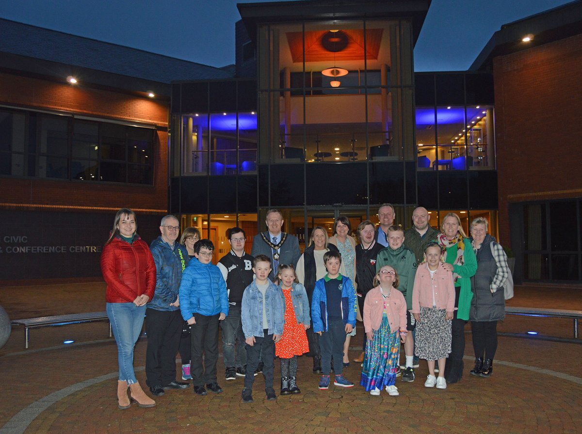 abcb_council's tweet photo. Lord Mayor, Cllr Paul Greenfield, along with Cllrs Julie Flaherty and Kyle Savage were delighted to receive some very special guests to Craigavon Civic Centre on Wednesday 22 March as the Council lit up its buildings in blue and yellow to mark Downs Syndrome Awareness week. https://t.co/jKNPwTBaaM
