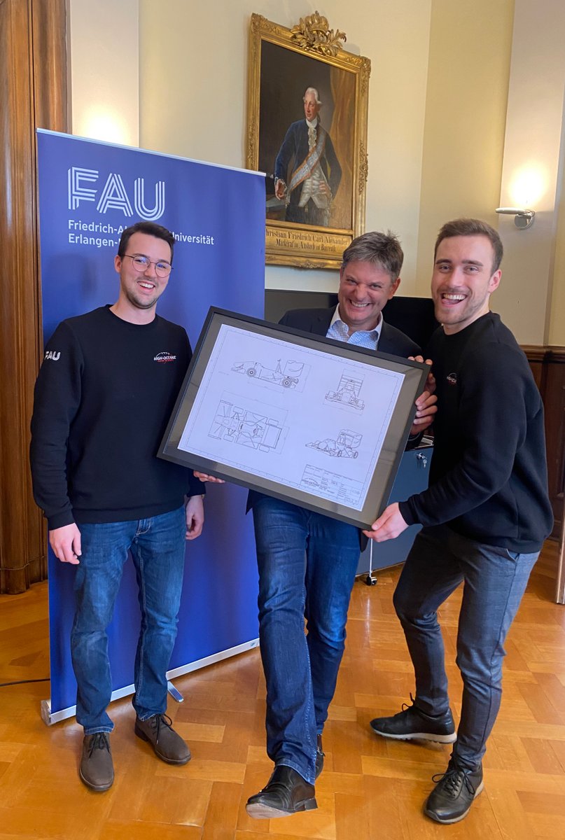 Hornegger's tweet photo. Today our #FAUstudents pushing #HighOctane visited me: Thanks to Alexander and Roger for the super inspiring conversation and the nice gift. @UniFAU @Octanes_News #FAUrocks #EngineeringRocks https://t.co/BBMtmoPv7E