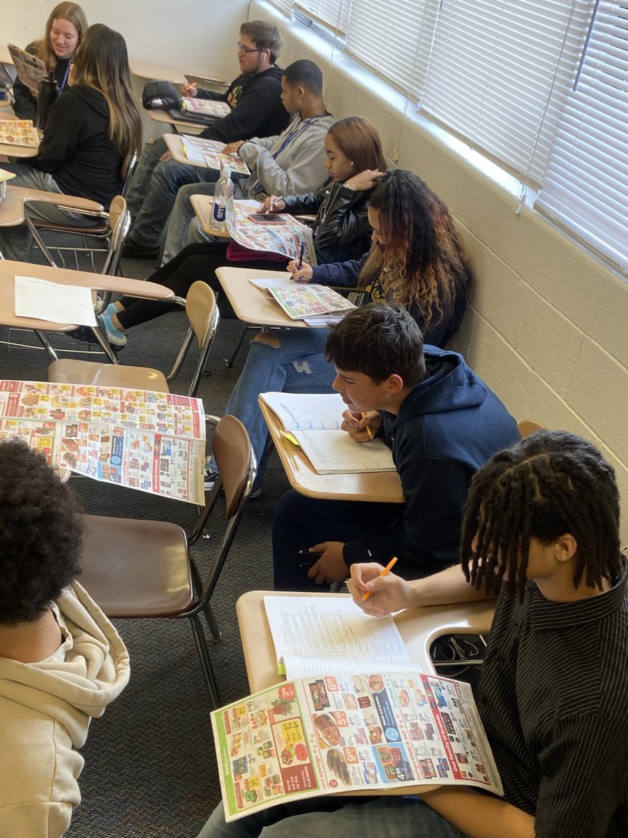 LPHS_News's tweet photo. La Plata High Schools Food & Nutrition students using grocery circulars to create a meal plan for two people for 7 days with a $100 budget. "This stuff is expensive!" #LifeLongLessons #WarriorSpirit https://t.co/K9bxOVbPw5