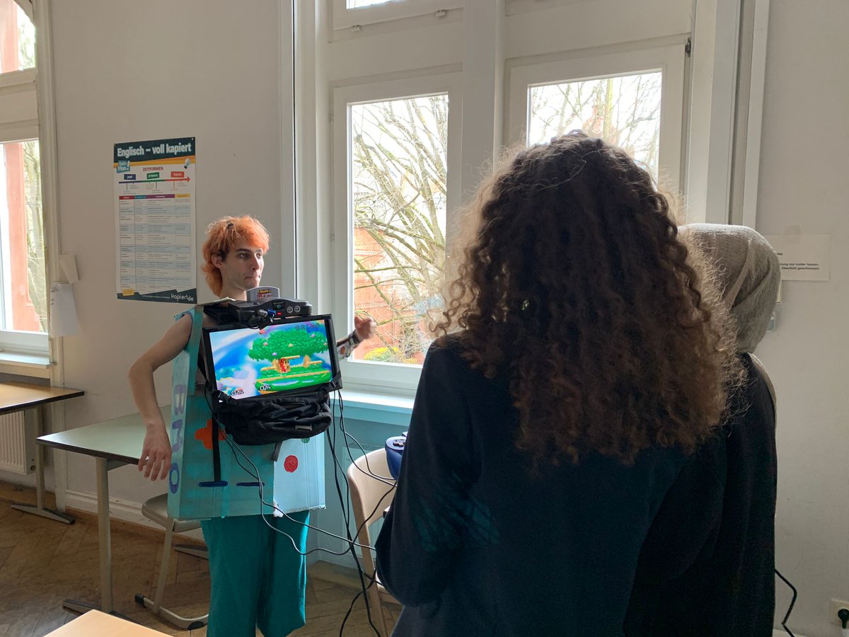 Proxygon42's tweet photo. @grandson wearing a selfmade BMO costume for theme week before A-levels https://t.co/Qq8Bjn7eKG