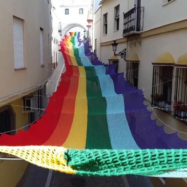 womensart1's tweet photo. 14 local Spanish women of the town of Aguilar de la Frontera took 2 months to create a giant rainbow flag to celebrate #LGBT people. The crocheters all suffer from fibromyalgia, a painful debilitating condition and crochet distracts from their pain #womensarteg https://t.co/gTy0lGEgQ8