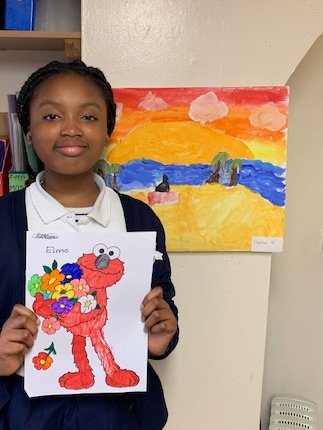 JDPSoffice's tweet photo. Charlene in Red 6 helped run an art club, here at John Donne, during lunch time. The beautiful painting of a sunset you see behind her, was her best work! #johndonneprimaryschool #artistinthemaking #artclub https://t.co/K11PSg5fb6
