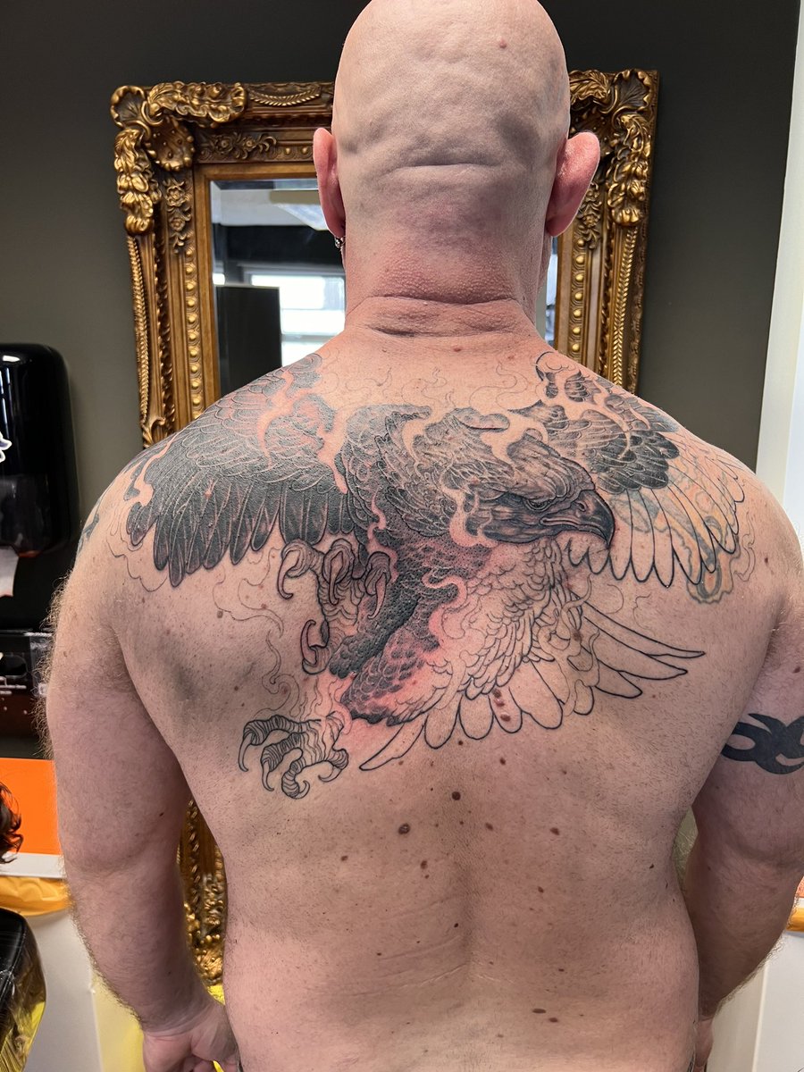 Muscleslave1's tweet photo. Having a great time with my AI-generated work, but back in the real world the first of the family tats is starting to take shape. Three sessions (21 hours total) down; perhaps 2 or 3 more to go to complete my phoenix. https://t.co/mJD9r8S8p3