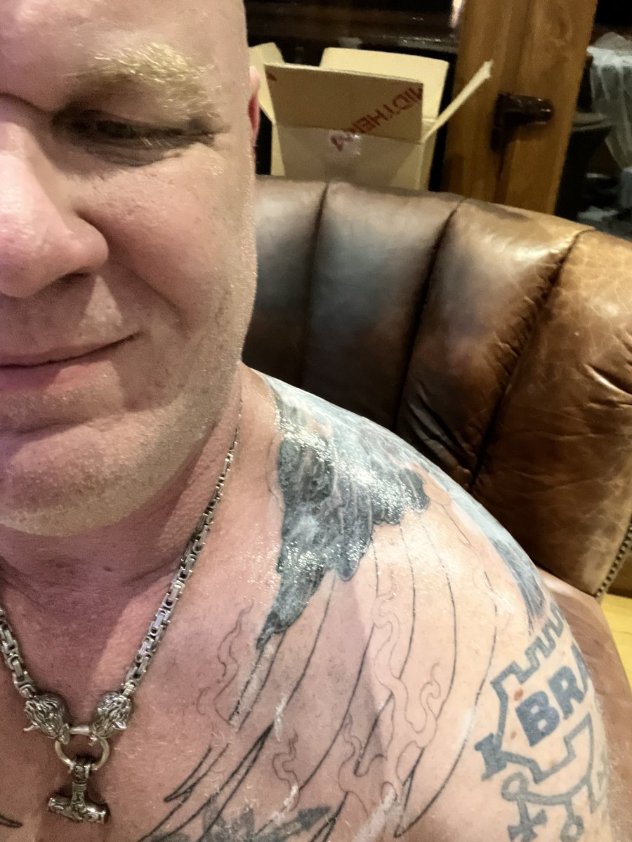 Muscleslave1's tweet photo. Having a great time with my AI-generated work, but back in the real world the first of the family tats is starting to take shape. Three sessions (21 hours total) down; perhaps 2 or 3 more to go to complete my phoenix. https://t.co/mJD9r8S8p3