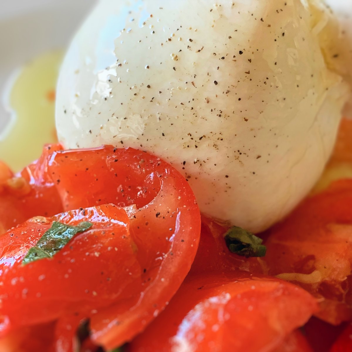 We can't get enough of burrata cheese from Puglia. It's so creamy and delicious, especially when paired with fresh tomatoes, basil and finished with a drizzle of olive oil from our olive grove. #WeAreInPuglia #ItalianCheese