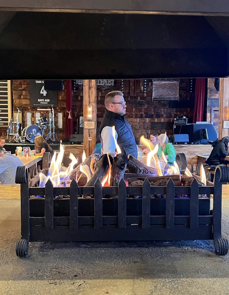 He stared at the fire.