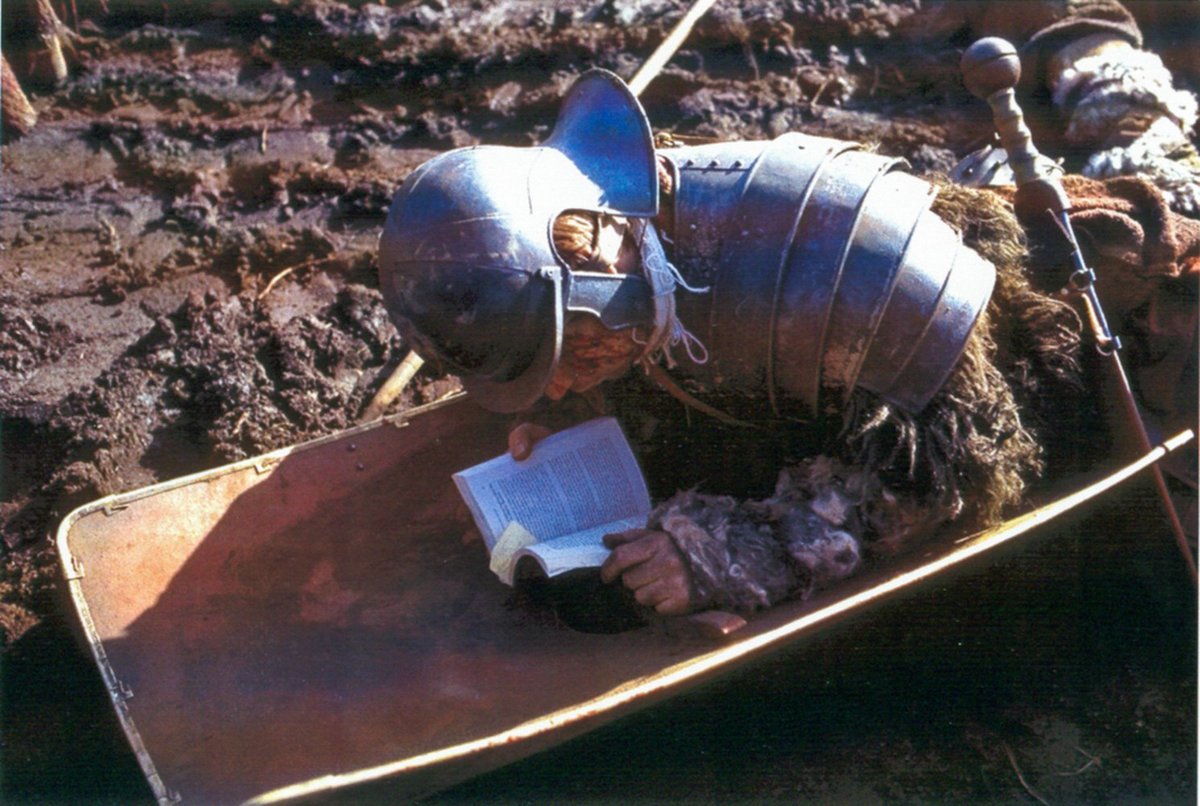 An extra passes time between takes while filming the opening battle of 'Gladiator' in Bourne Woods, Surrey, 1999.
