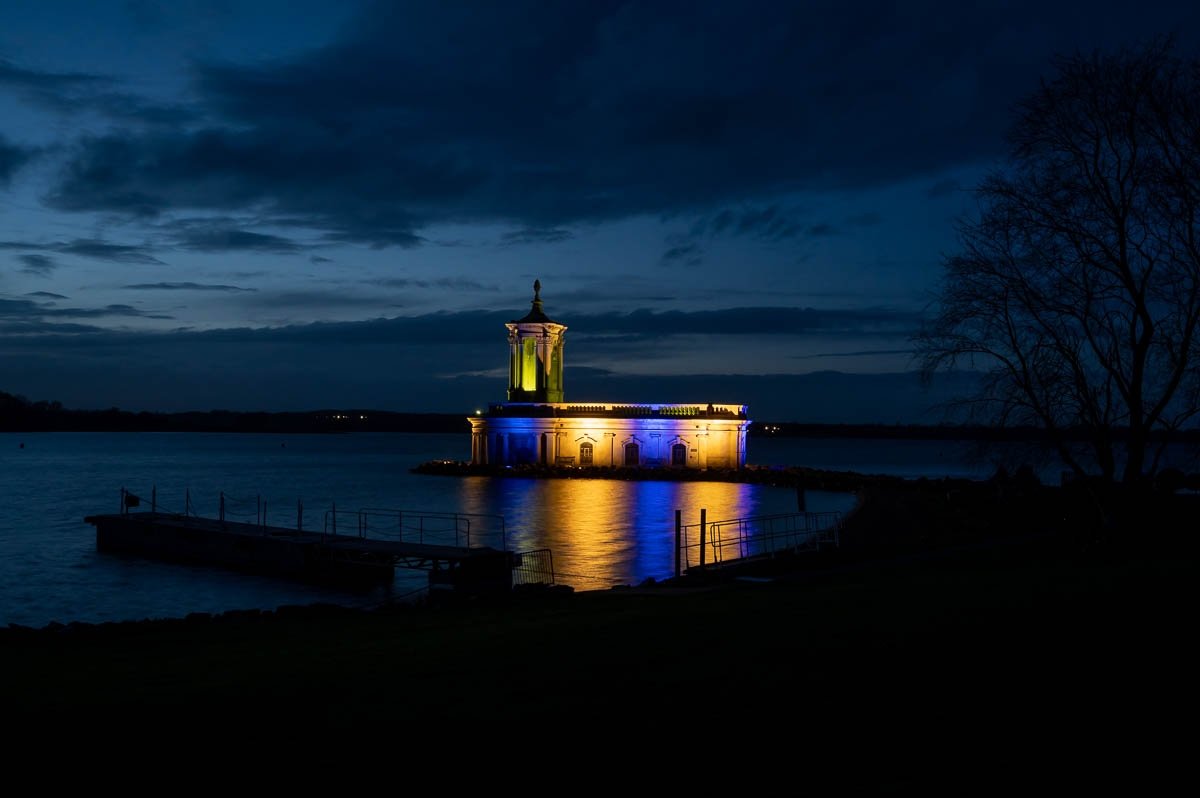Normanton Church @RutWaterPark floodlit in a variety of colours in support of @mariecurieuk #nationaldayofreflection  #Rutland
