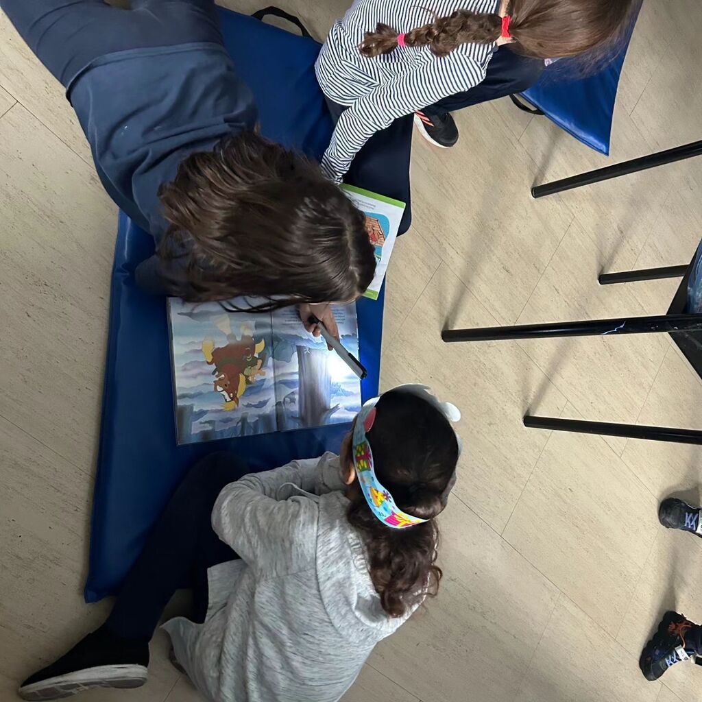 Ms. Janna and Ms. Amanda's class had some fun partner reading in the dark during SFA.