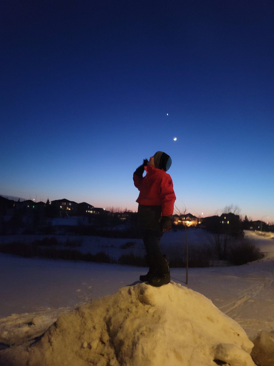 Watched <a href="/drbecky_/">Dr Becky Smethurst</a> 's latest video: youtu.be/TYRLKUg4RkQ just an hour ago. My son wasn't sleeping yet so I took him out to see a few things from the video. Things he saw tonight:
Toenail moon
Venus
Jupiter 
(Mercury was too low)
ISS (woo!)
Northern Lights
Here he is looking up!