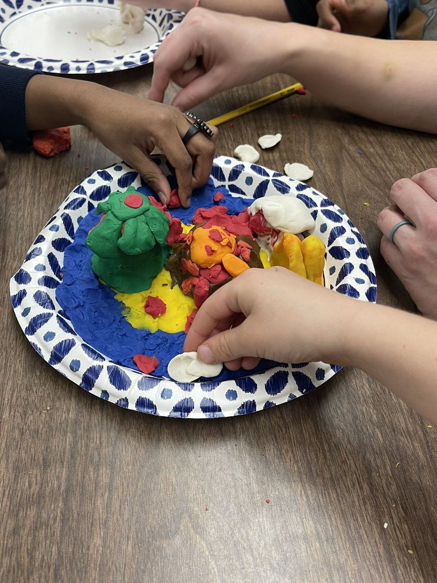 2nd grade having fun making landforms