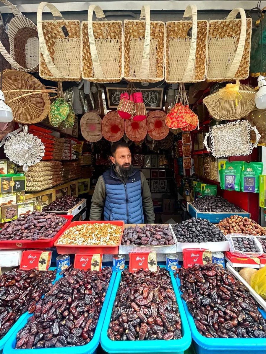 MOMIN081's tweet photo. A shopkeeper selling dates waits for customers during the first day of Ramadan at a market in Srinagar
📷 #Basitzargar https://t.co/IxuvFFjbxg