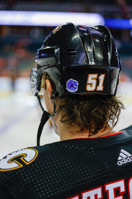 A shot of the #SnowyStrong sticker on Troy Stecher’s helmet