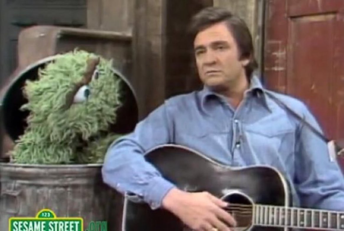 Super70sSports's tweet photo. In a jarring moment for children everywhere, Johnny Cash got tired of Oscar the Grouch's bullshit and beat him with his guitar. https://t.co/sIFoeE4qsW
