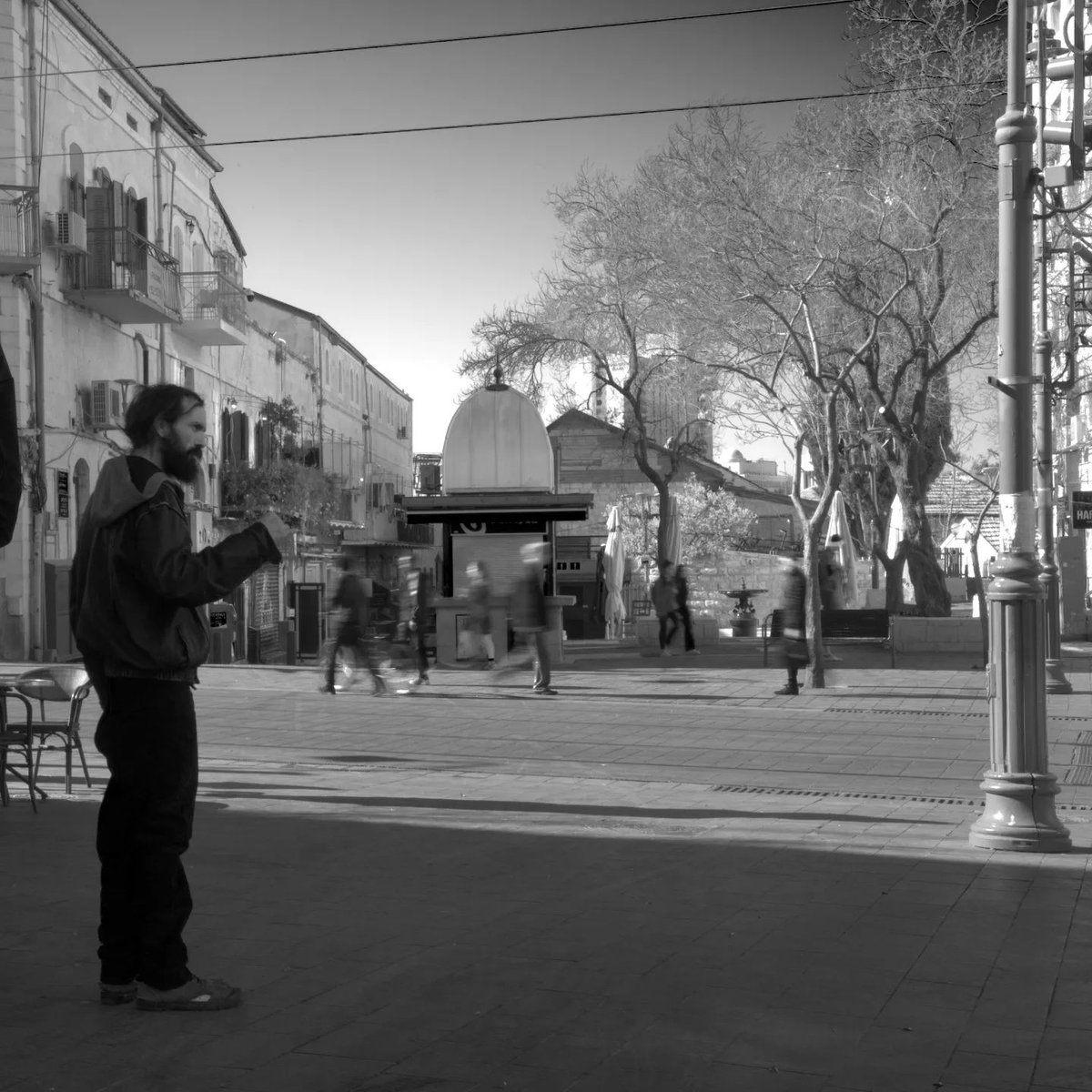MarcoFosci's tweet photo. Jerusalem, people come and go towards their commitments, a man argues perhaps with himself.
—
#jerusalem #moderntimes #people #street #israel #black #white #bnw #bnwphotography #blackandwhite  #monochrome #bnwphotos #moments_in_bnw #moments_in_photography #moments #moments_in_str https://t.co/XRJBuCCJOK