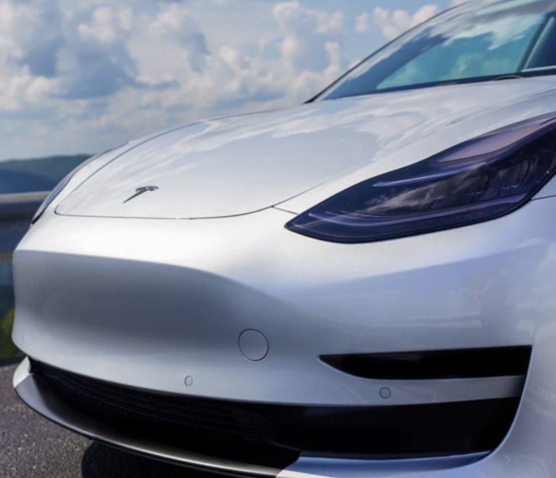 hey_anish's tweet photo. Front bumper on Project Highland Model 3 refresh appears to have a longer, more rounded nose underneath the cover. Rumors of updated headlights would also explain the extra taping on the covers as well. 
#Tesla #ProjectHighland #Model3 #Model3Refresh https://t.co/FHF48akzik