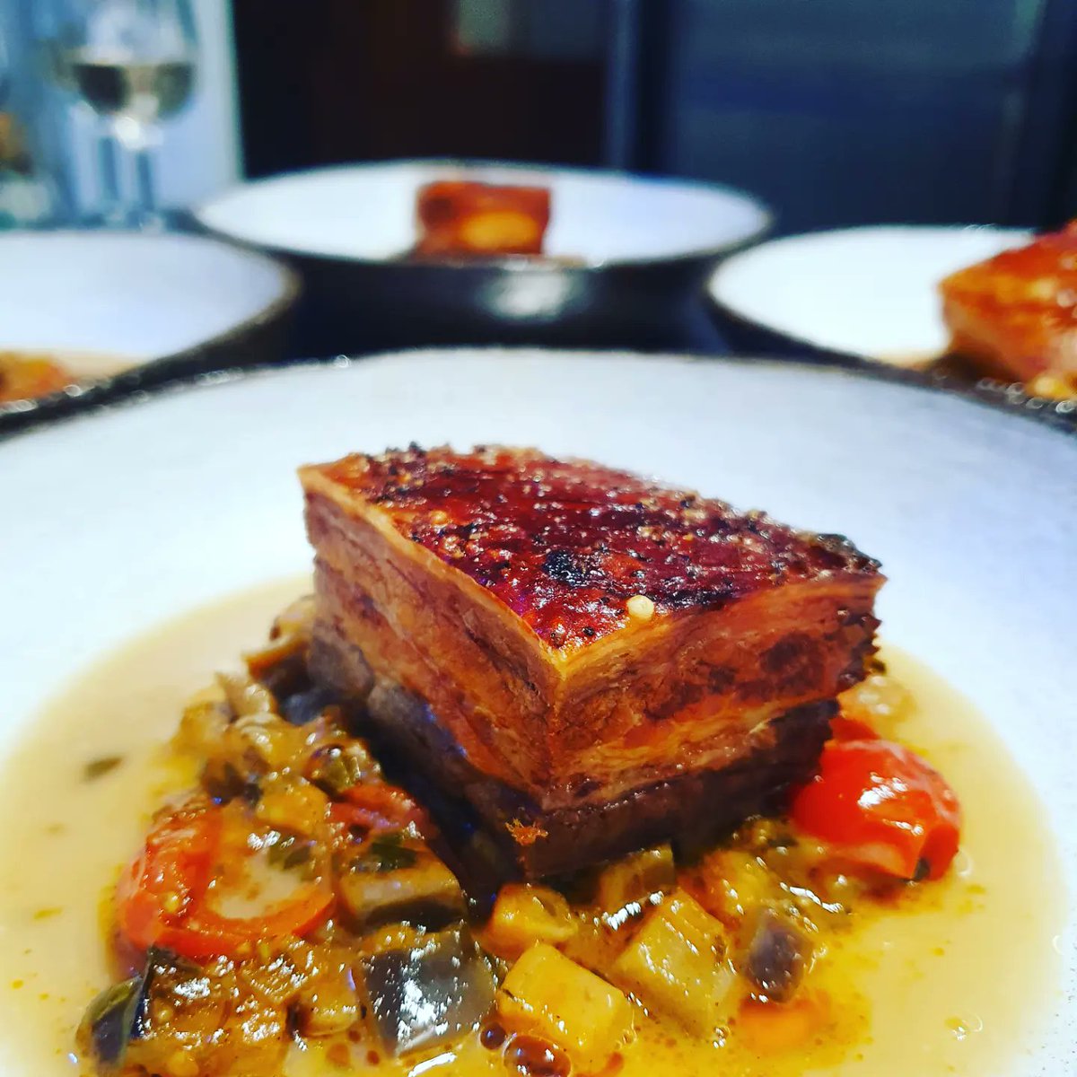Confit Of @humblepigfarmer pork belly Vindyloo with Marsala aubergine & cherry tom's. Classically French with a Punjabi twist. It's not just knowing how to cook its more about the food trail that leads us to what we deliver to our guests.

#keepinitlocal