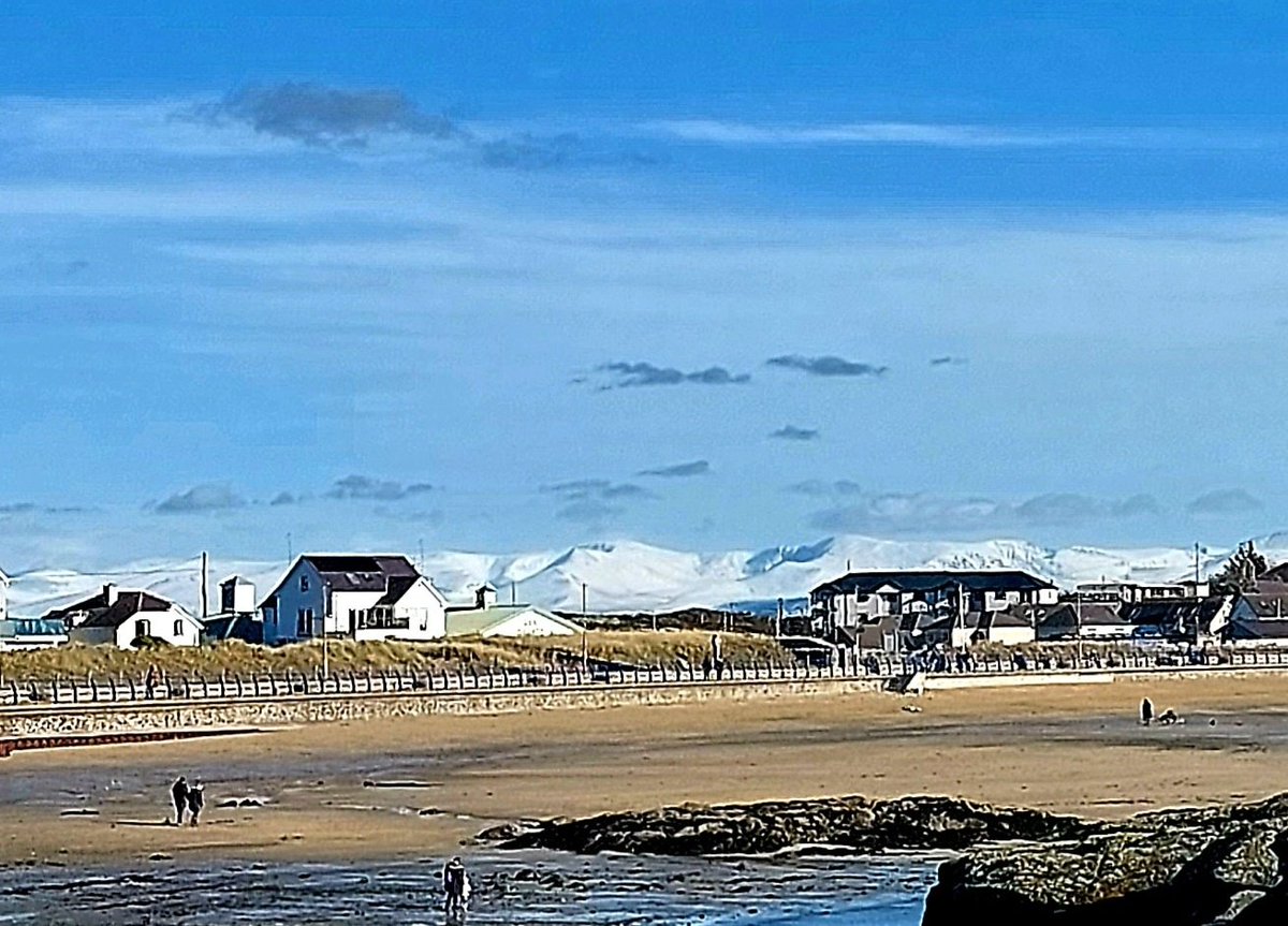 Snowy Snowdonia from Trearddur Bay on Friday.

There are worse places to work! 🌊❄️

#Anglesey 
#YnysMôn