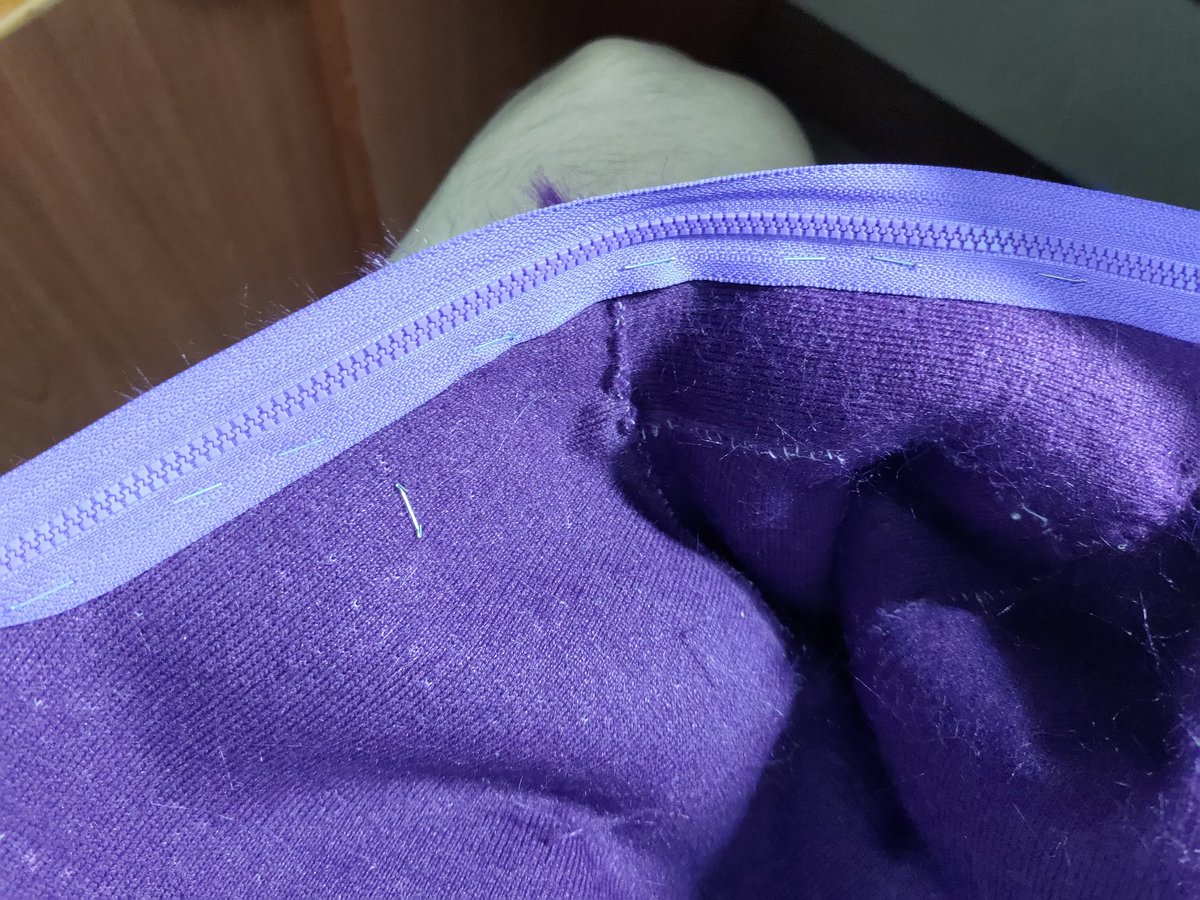 Stapling a zipper to keep it in place for sewing. I'm not sure if this is allowed, but I feel that the results are quite promising!