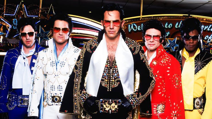 Critics Destroyed 3000 Miles to Graceland when it came out, but I came for : 

-Kurt Russell replaying Elvis
-Costner as Alpha Evil Elvis with a glorious cape 
-Bokem Woodbine as Black Elvis with sideburns  
- heavy squibs &amp; muzzle fire
-Filmmaker on uncut Coke

Lo,, I was happy.