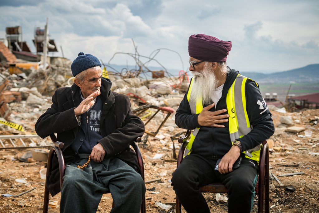 RaviSinghKA's tweet photo. Language isn't a problem when we reach out to each other, it's our prejudices which are the barriers. 

This #Turkish elder was sitting in front of fallen houses in the Turkish city of #Kahramanmaraş

We shared our grief at the loss of life. We didn't need to speak… #Türkiye https://t.co/U3bNgfFFyu
