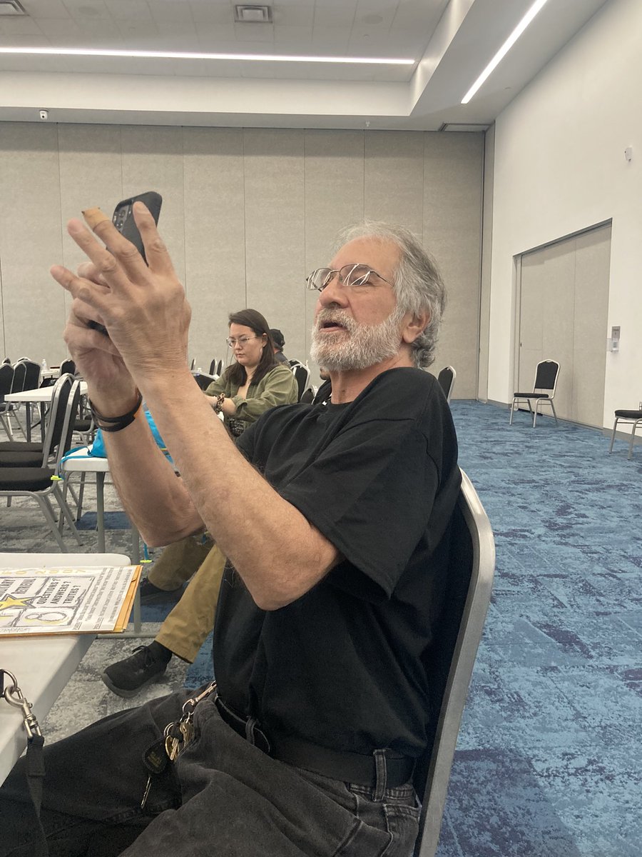MrsPosterity's tweet photo. At #UFOXPO1 @SteveBassett live via Zoom at @UFOXPO1!! “Join me on Twitter, #MonthsNotYears” “Capital D Disclosure” ~ Steve Bassett

Mr. Michael Padilla @gitarmanNM505 taking pics here representing #AztecUFOCrash #AztecNM
(Ask him about Leanne’s Satchel!)👏👏🖖🫶💜🎸🛸👽🏜️🌵💃🇺🇸✨ https://t.co/HIhPTFAcBL