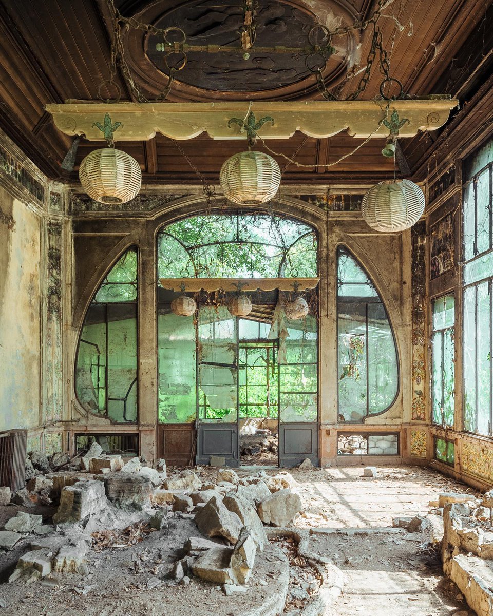 The view inside a breathtaking abandoned art nouveau wintergarden, in Italy. Built in the 1890s this orangery & adjacent villa was once a wedding gift from a wealthy entrepreneur to his wife. Photo by Reginald Van de Velde