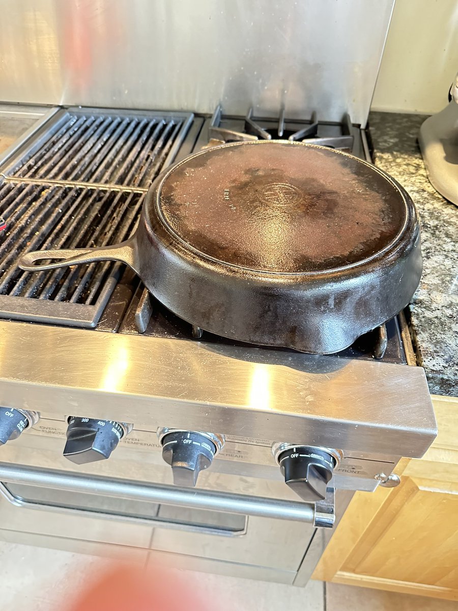 Seasoning using a burner. 

1st cleaned using vinegar on a paper towel. Then washed with dish soap and water. Heated to dry. Also am in process on a stew. So burner for the cast iron rehab. Tenants used whatever and scoured the pan. Grrr