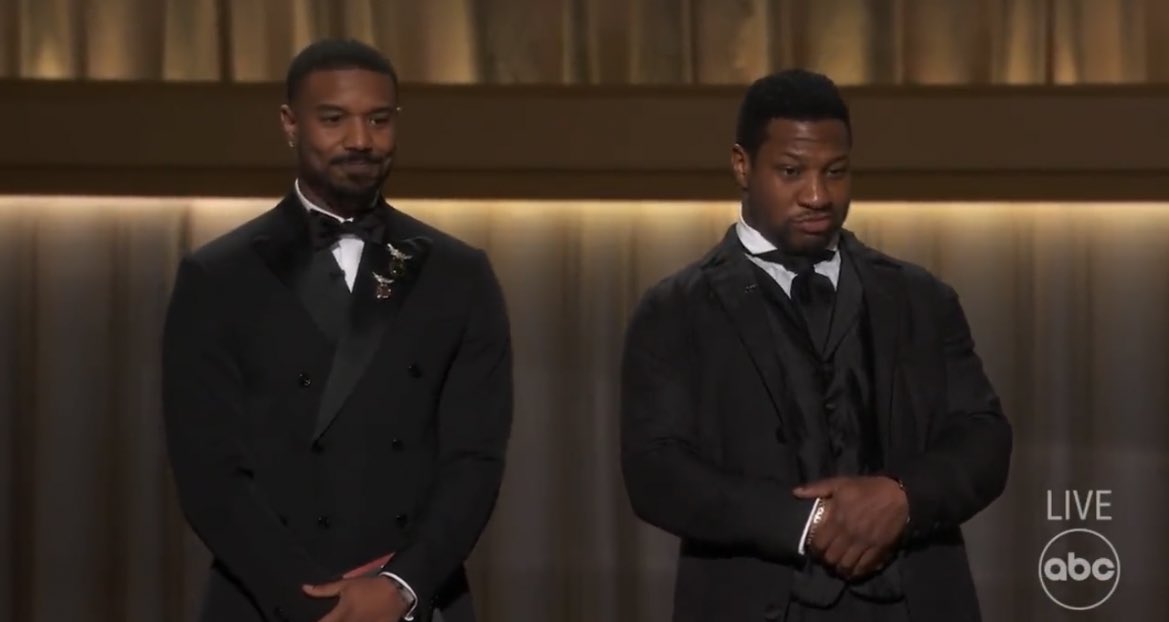 PopCrave's tweet photo. Michael B. Jordan and Jonathan Majors give a shoutout to Angela Bassett before presenting at the #Oscars: 

"Hey Auntie, we love you." https://t.co/CLU7pqznQz