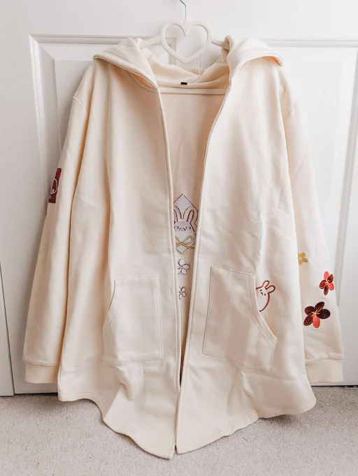 YOTR LONGLINE HOODED CARDIGAN100% cotton french terrymidweight, slightly structured fabricloose, flowy fit with a wide base that falls lower in the front than the backfully embroidered details (including bun in pocket)size in photos is M on a 5' 3" person 