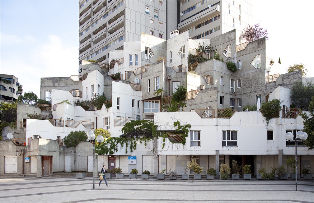 Repeating and varying shapes, stairs leading in different directions and levels, exposed concrete paired with a lush green jungle. 

Renée Gailhoustet/Jean Renaudie: Triangle Housing, Ivry-sur-Seine, France, 1969–1978
sosbrutalism.org/cms/15891387⁠
⁠© Clement Guillaume
#SOSBrutalism