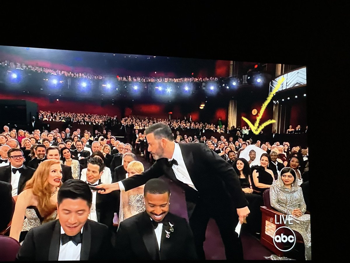 Whoever is stuck sitting behind this big white veil/dress is PISSED, and probably also one of the shortest people in the room 😂 #JustMyLuck #ShortPeopleProblems They’ve spent the entire ##oscars leaning left/right into their seatmates to see anything.  #rude