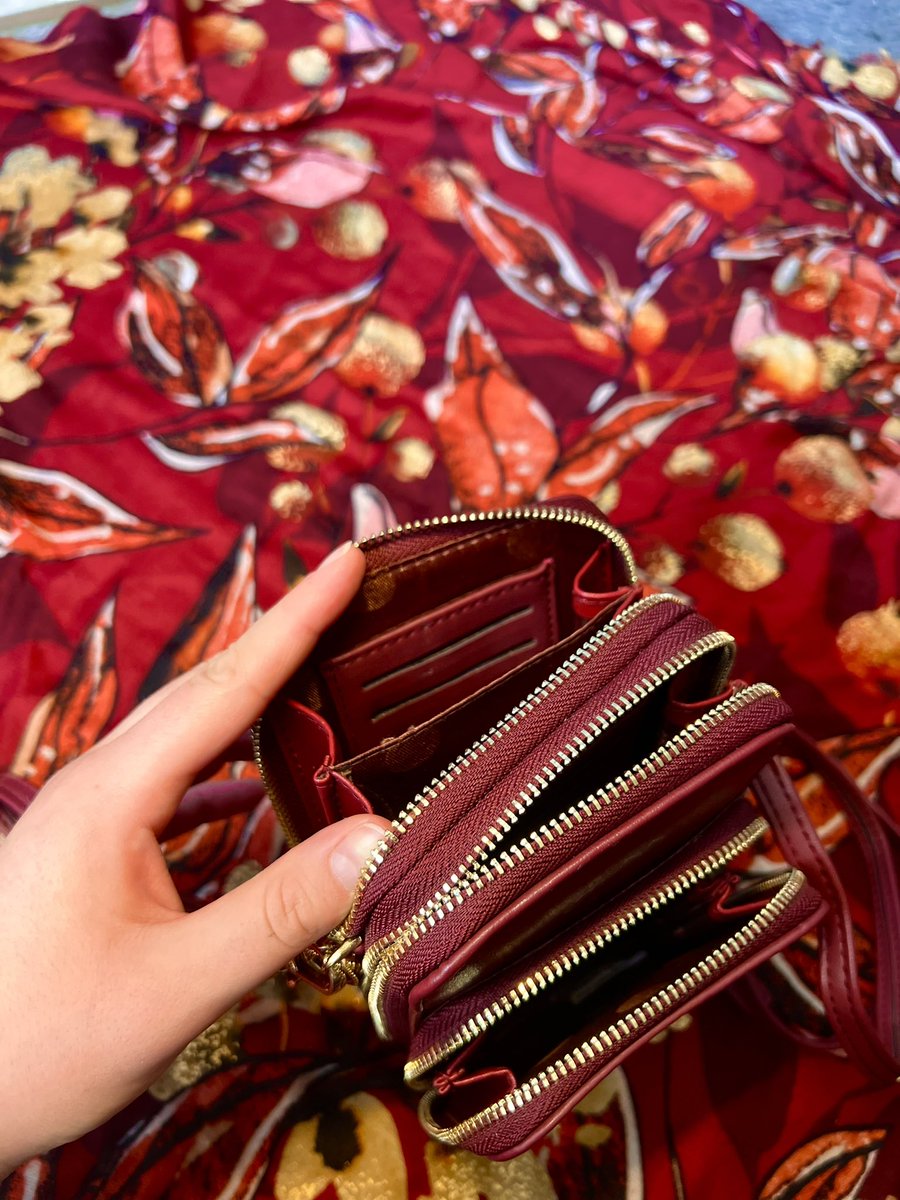 FOR SALE! $60 DM TO PURCHASE! :) 
Red leather rose bag with three zipper pockets, wrist strap, AND adjustable body strap. Two larger pockets are able to hold five debit cards each! Hand painted by me! ❤️💋