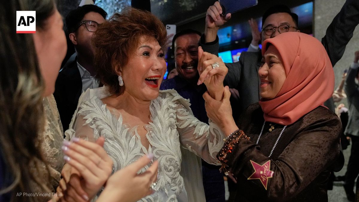 Janet Yeoh, mother of Michelle Yeoh, celebrates during a live viewing at a cinema in Malaysia after her daughter won the Oscar for best actress.

“I have to dedicate this to my mom and all the moms in the world,” Michelle Yeoh said during her speech. bit.ly/3JJl2jL