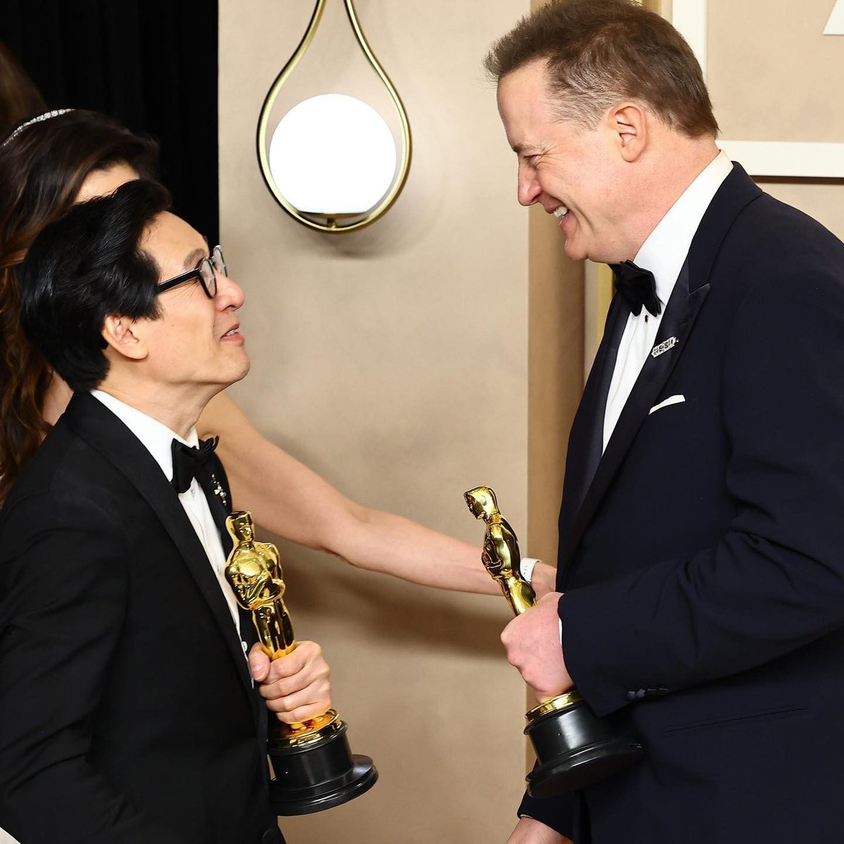 enews's tweet photo. "We're still here." ❤️ Ke Huy Quan &amp; Brendan Fraser cap off an unforgettable awards season. #Oscars (📷: Getty) https://t.co/BZ5DCT6FYA