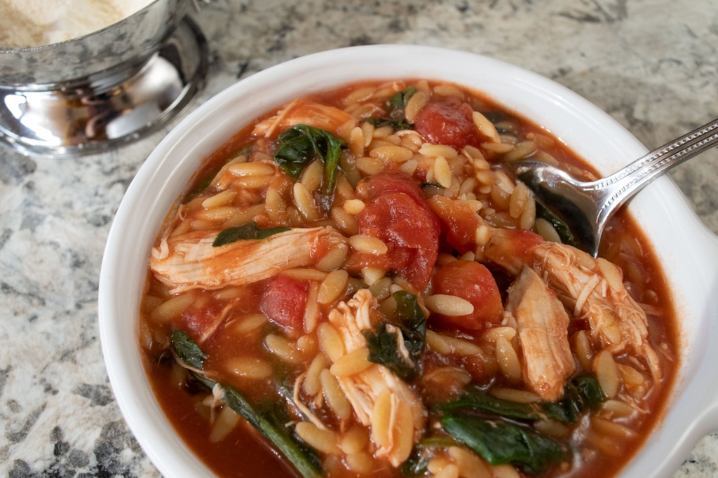 Aunt Carmella was back in the kitchen! She cooked up an amazing chicken soup, with spinach and tomatoes! You HAVE to try this! l8r.it/bh0N