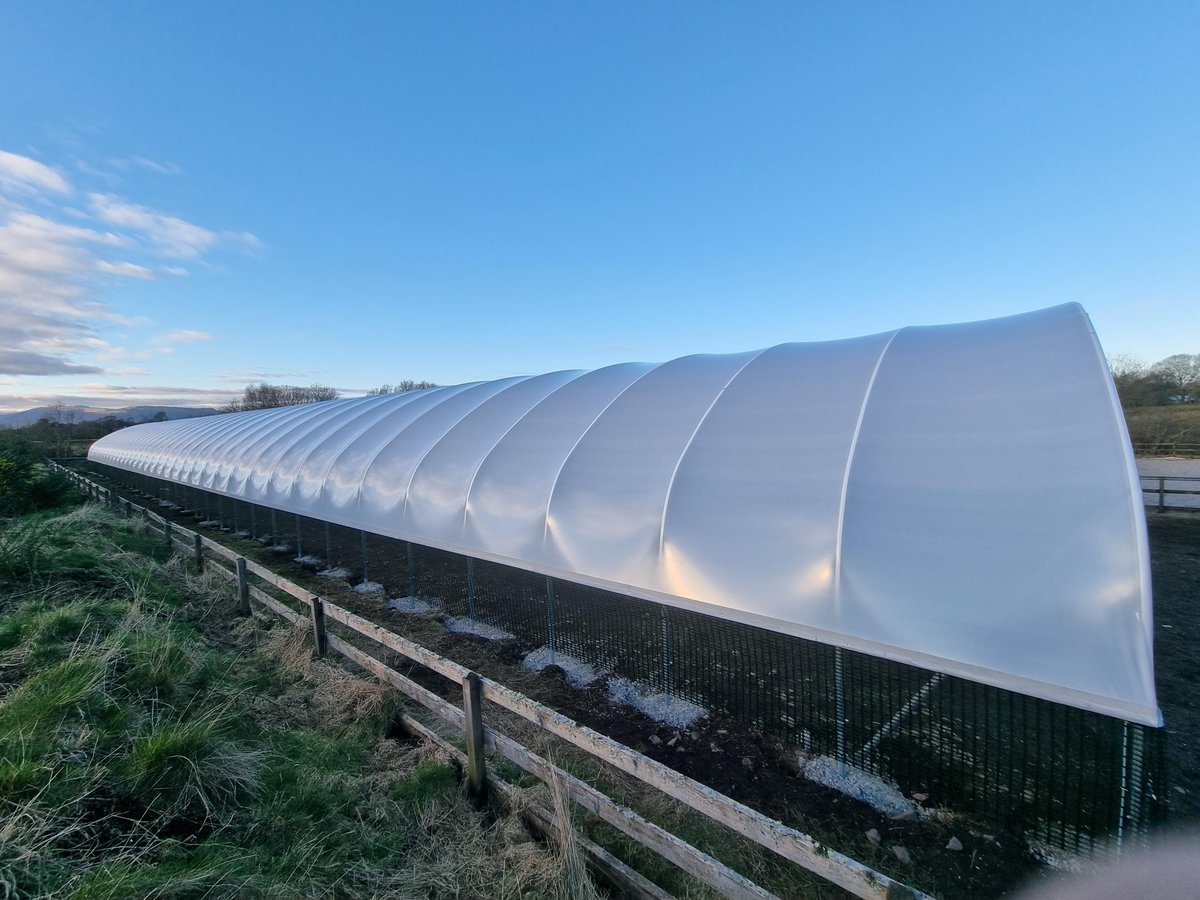 NorthernPolyt's tweet photo. An impressively long sheep house we recently manufactured and installed in Oban, Scotland. 

The structure measures 30ft wide by 180ft long...that's a lot of sheep space.

#Livestock #Sheep #SheepHouse #Oban https://t.co/NIjvU8r3jq