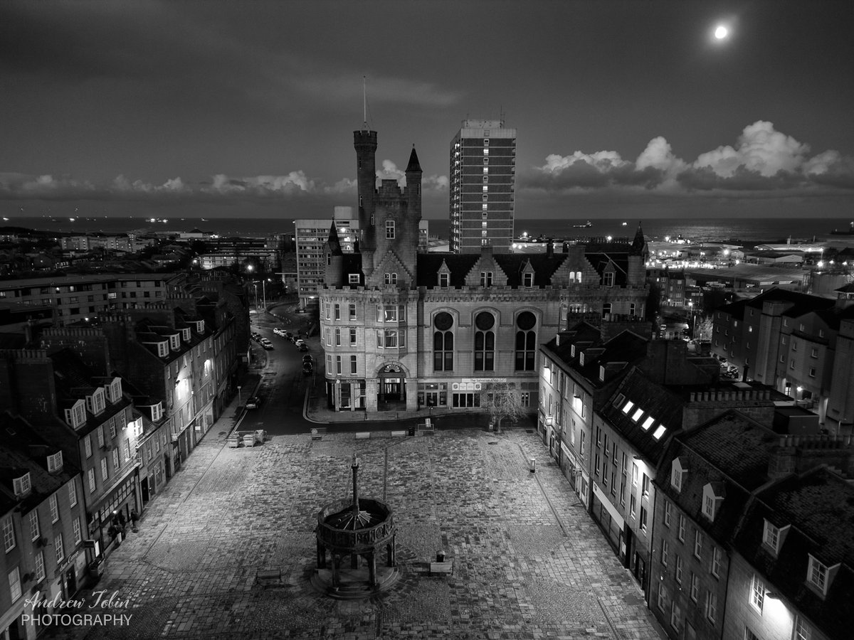 Black &amp; white aerial view of the historic Castlegate, Aberdeen at night with the worm moon.
#visitabdn #blackandwhitephotography #dronephotography #SCOTLAND #aberdeen