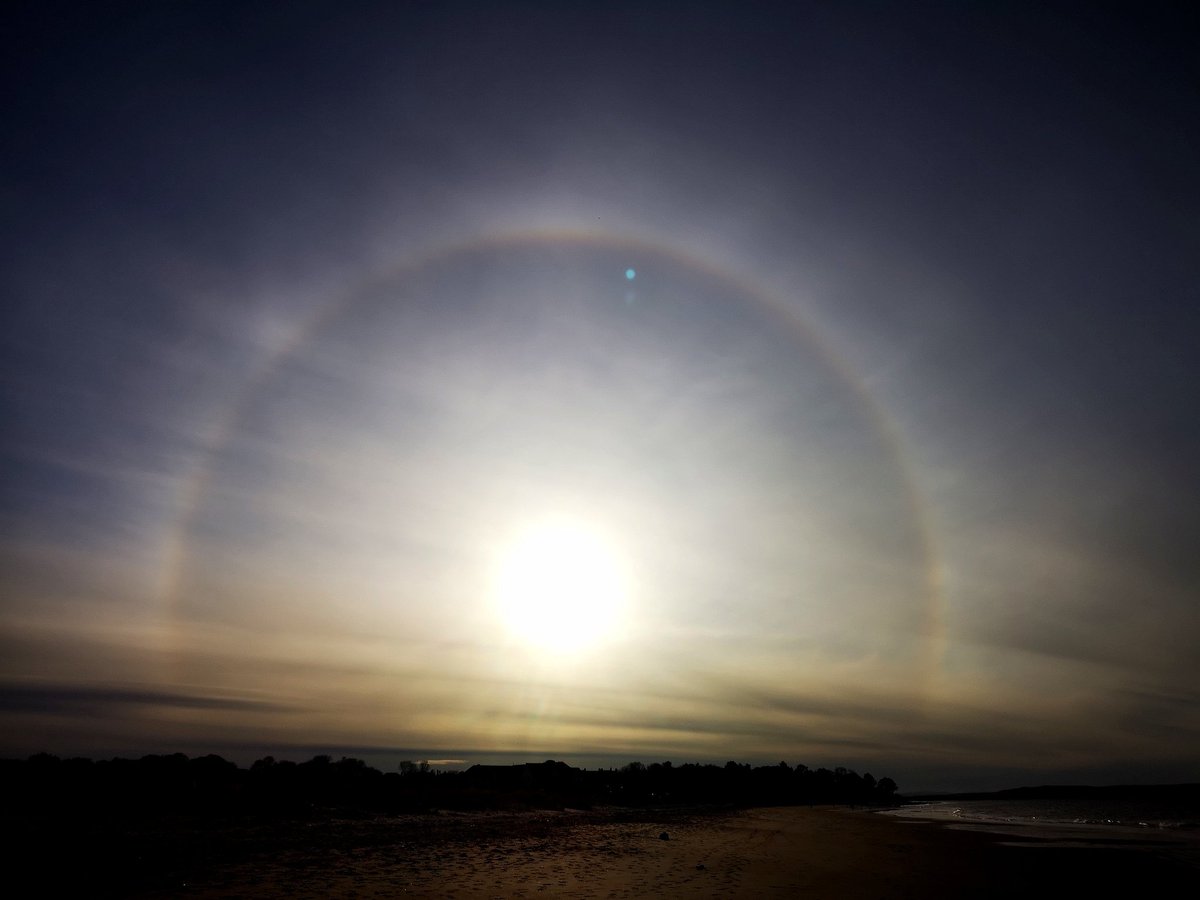 A 22-degree halo spotted over Nairn Beach, Scottish Highlands, Scotland, by @HemsworthImages