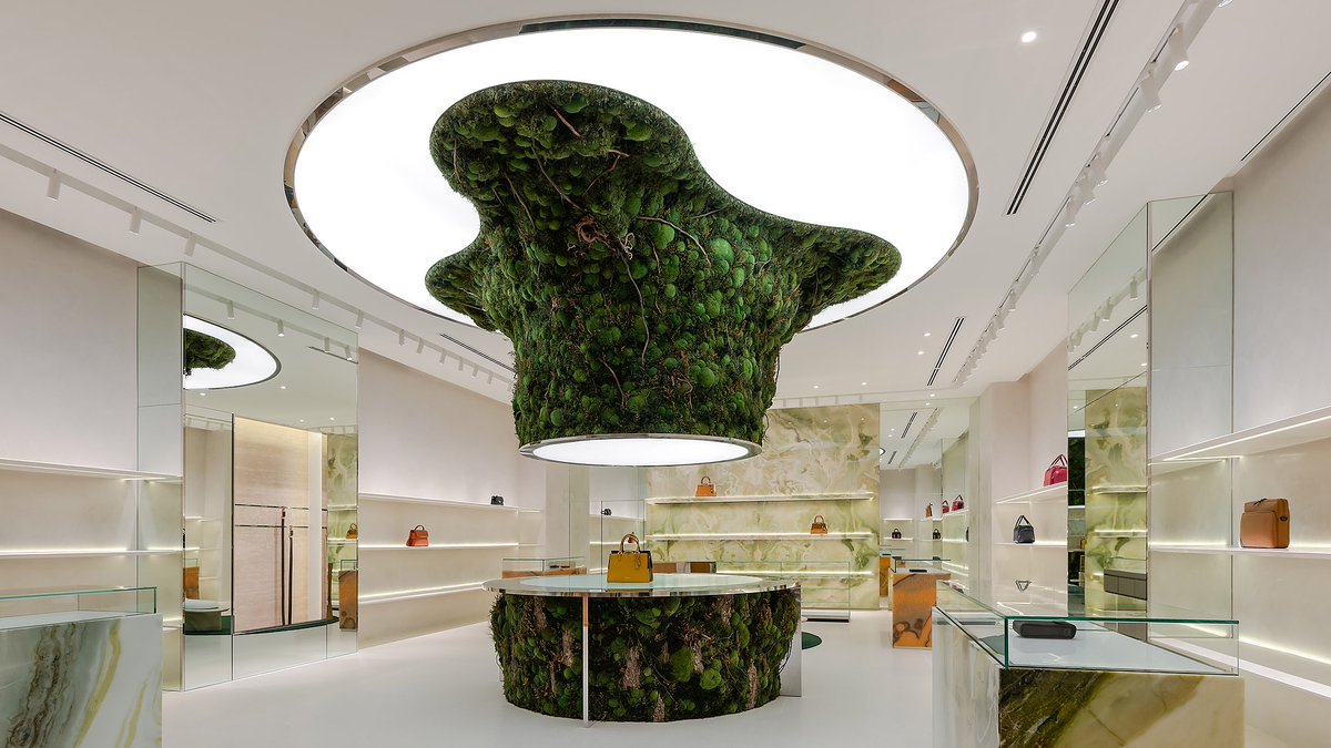 Creative studio Spacemen used biophilic design principles to design a tree-like installation covered in moss, which forms the centrepiece of a flagship outlet for luxury leather brand Braun Büffel in Malaysia. Read more via @dezeen bit.ly/3Tamxua